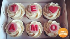 cupcakes in a box with the word team spelled out to spell them on top