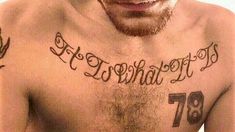 a man with tattoos on his chest has the words happy birthday tattooed on his chest