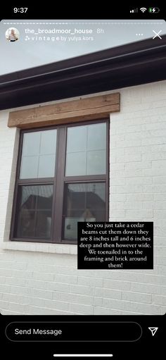 an image of a white brick building with a window that has a poem written on it