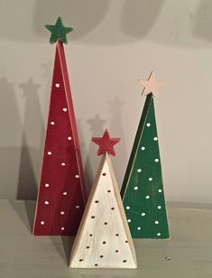 two small wooden christmas trees sitting next to each other