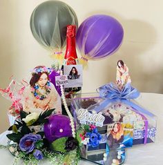 a table topped with balloons and other items