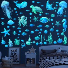 an ocean scene with jellyfish, starfish and other marine creatures glows in the dark