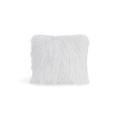 a white pillow with fluffy fur on the front and back side, sitting against a white background