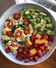 a bowl filled with pasta and vegetables on top of a table