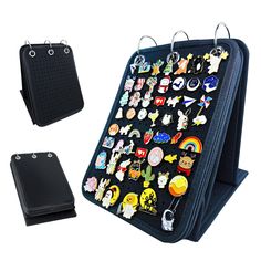 a black case with lots of different pins and magnets on the back of it