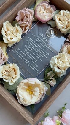 a wooden box with flowers on it and a poem written in the bottom right corner