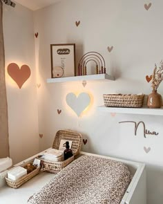 a baby's room with hearts on the wall