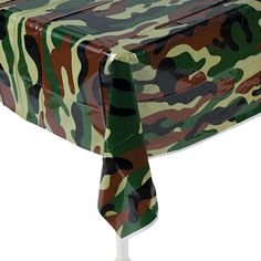 a camouflage tablecloth on a white background