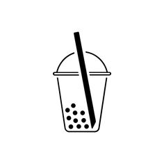 a drink in a glass with a straw on the top and dots around the rim