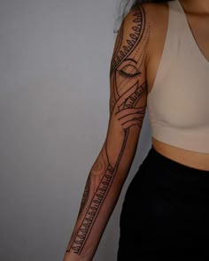 a woman with a tattoo on her arm