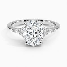 an oval cut diamond engagement ring with side stones