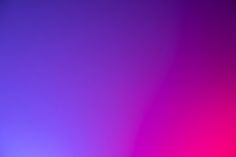 a blurry image of purple and pink colors in the background, with only one light visible