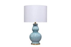 a blue table lamp with a white shade