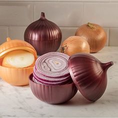 onions, onion and garlic on a marble counter top