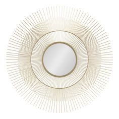 a round mirror with gold lines around it