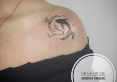 a woman with a tattoo on her shoulder