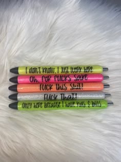 four pens that say i can't know what happy they are on, one for each