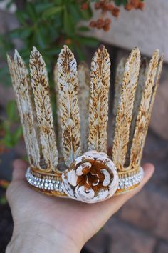 Handmade rusted crown with flower and crystals. These crowns are 100% handmade. They soldered from metal, not flimsy, but very sturdy. I painted them with a homemade paint for that shabby and unique look. Added some silver tone crystals and rusted flower. This is the large size crown from the bunch. The measurement: Large - 4" in diameter ( 12" in circumference) About 4 1/4" high These tall rustic crown can be used for so many projects. Have fun and enjoy creating and decorating. Crown Shaped Wreath, Handmade Adjustable Whimsical Crown, Metal Flower Crown, Whimsical Crown-shaped Headband For Gifts, Silver Crown-shaped Metal Jewelry, Handmade Crown, Crown Decor, Leaf Crown, Homemade Paint