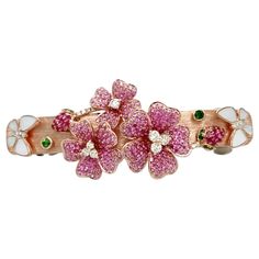 18K Rose Gold Flower Garden Ruby & Pink Sapphrie Colored Diamond Hair Clip 6 Diamonds - 0.02 CT 23 Colored Diamonds - 0.47 CT 10 Green Garnets - 0.22 CT 461 Rubies/Pink Sapphires - 2.33 CT 8 Mother of Pearl - 0.65 CT 18K Rose Gold - 12.54 GM Our flower garden hair clip is with the stunning combination of colored diamonds, rubies, pink sapphires and green garnets, which helps you feel happier, healthier and more confident. Three gorgeous flowers with beautiful details made of different precious s Diamond Hair Clip, Diamond Hair, Rose Gold Flower, Green Garnet, Gold Flower, Gold Flowers, Pink Sapphire, 18k Rose Gold, Hair Clip