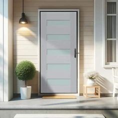 a white front door on a house with potted plants