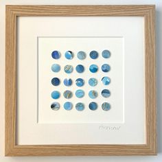 a white frame with some blue circles on it