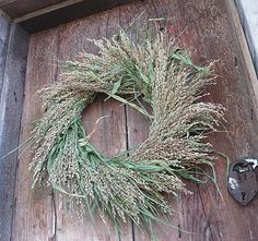 a wreath on the side of a wooden door