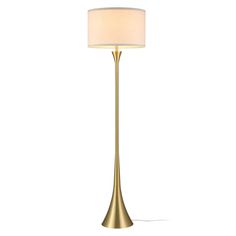 a gold floor lamp with a white shade