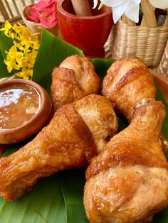 some chicken wings and dipping sauce on a plate