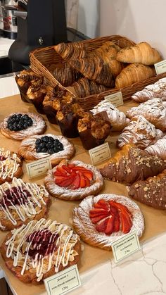 breads and pastries on display in a bakery