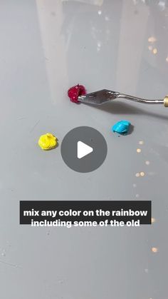 a spoon with some candy on it and the words mix any color on the rainbow including some of the old