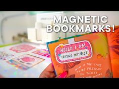 a person holding up a book with magnets on it and text reading magnetic books