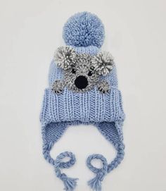 Knit pom pom hat with earflaps, strings and a crochet Koala applique sewn onto. Cute winter outfit for kids, teens and women as well:) Choose your size and color using drop down menu. Available sizes: Toddler 1-3yr 18-20(46-50cm) Child 3-10yr 19-21(49-52cm) Teens/Adult Small 20.5-22(52-55cm) Adult Koala Applique, Crochet Koala, Lion Hat, Hat Pom Pom, Knit Pom Pom Hat, Cute Hat, Toddler Winter, Hat Knit, Women Hat