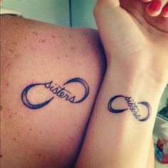 two people with matching tattoos on their arms