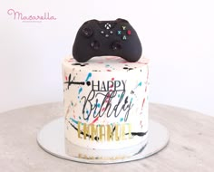 a birthday cake with a controller on top