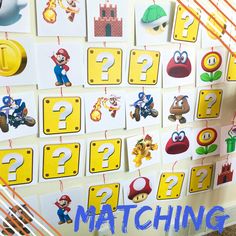 there are many pictures on the wall with numbers and mario bros characters attached to them