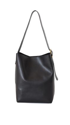 PRICES MAY VARY. Structured base Length: 13.75in / 35cm, Height: 13.5in / 34cm, Strap drop: 11.5in / 29cm, Depth: 5.5in / 14cm Hidden magnetic closure at top Patch interior pockets Adjustable straps The Essential Bucket Tote in Leather Madewell Bucket Bag, Bucket Tote, Women Essentials, Models Off Duty, Kids Luggage, Luxury Store, Pharmacy Gifts, Off Duty, Magnetic Closure