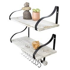 two tiered shelves with rocks on top and one shelf holding a potted plant