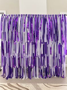 purple and white streamers hanging from the ceiling