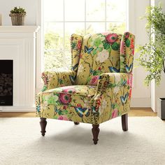 a floral chair in front of a window