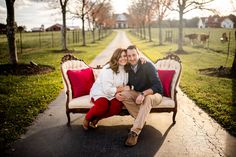 a man and woman are sitting on a bench