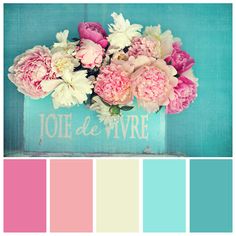 pink and blue flowers in a vase with the words jolie de vie on it