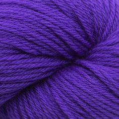 purple skeins of yarn on a white background