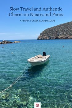 a small boat floating on top of clear blue water