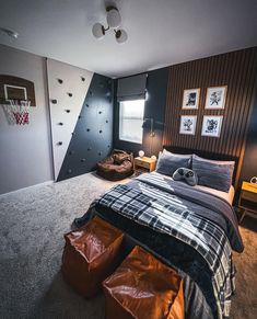 a bed room with a neatly made bed and two foot stools on the floor