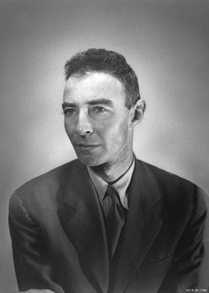 a black and white photo of a man in a suit