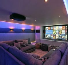 a living room filled with furniture and a flat screen tv mounted to the wall above it