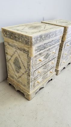 two wooden drawers sitting next to each other