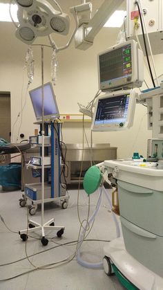 an operating room with medical equipment in it