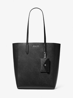 Our Vincent tote bag embodies polished practicality with a streamlined shape, spacious interior, and a detachable card case that keeps your essentials conveniently within reach. It’s crafted from rich Saffiano leather for a timeless look that’ll go with any outfit. Black Leather Tote Bag, Michael Kors Outlet, Leather Card Case, Zip Tote, Black Tote Bag, Large Tote, Clutch Wallet, Blue Bags, Leather Tote Bag