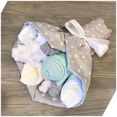 a baby's diaper is wrapped in grey and white fabric with stars on it